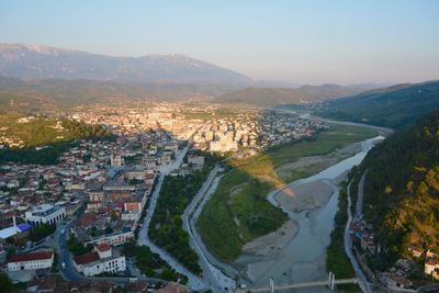 High angle view of townscape and mountains against sky