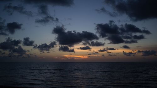 Scenic view of sea at sunset