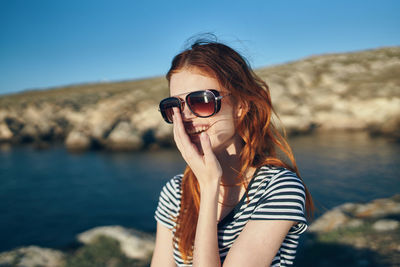 Portrait of woman wearing sunglasses