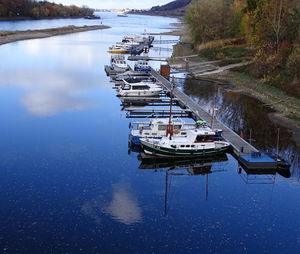 High angle view of sailboats moored in lake