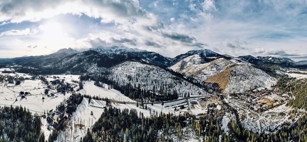 Scenic view of snowcapped mountains against sky