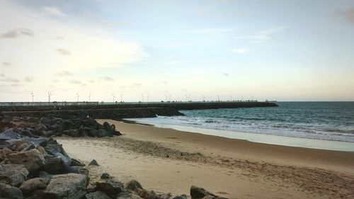 View of beach against sky during sunset