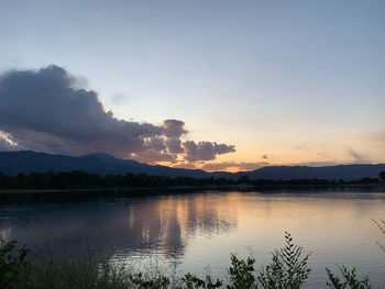 Scenic view of lake against sky during sunset