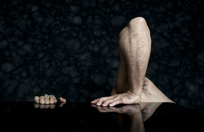 Cropped image of man on table