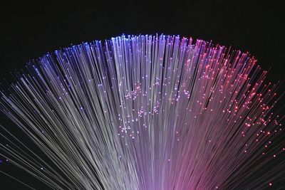 Close-up of illuminated lights against black background