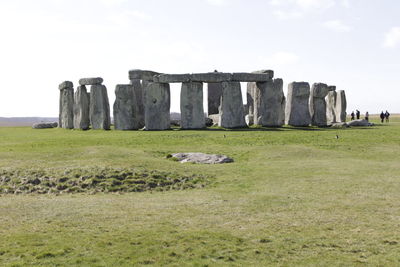 Built structure on field against sky