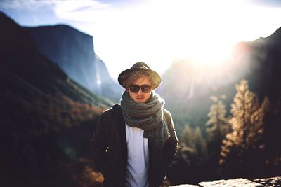 Portrait of woman standing against sky