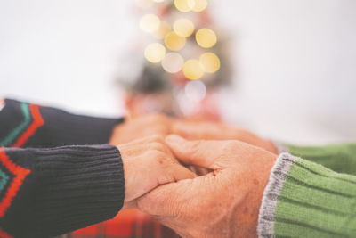 Man and woman holding hands during christmas