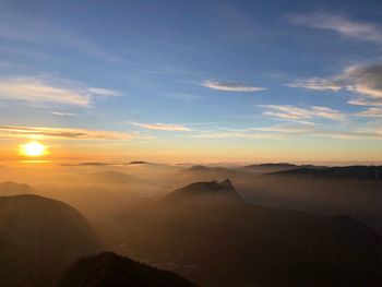 Scenic view of mountains against sky during sunset