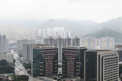 High angle view of buildings in city against sky