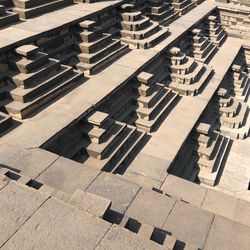 High angle view of staircase in building during sunny day