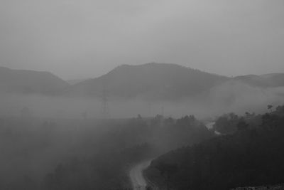 Scenic view of mountains in foggy weather