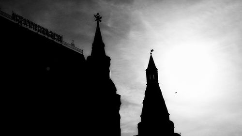 Low angle view of silhouette church against sky