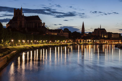 Illuminated city at waterfront