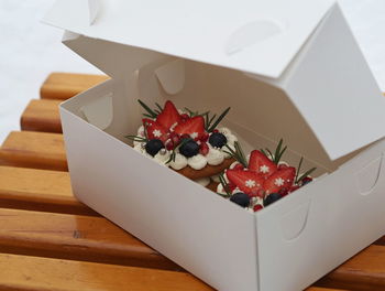 Close-up of fruits in box on table