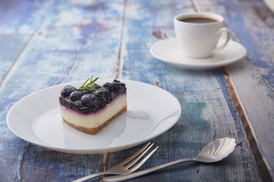 Cup of cake on table