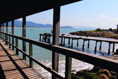 Pier over sea against sky