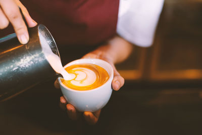 Close-up of woman holding coffee cup