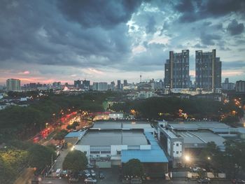 Illuminated cityscape against sky