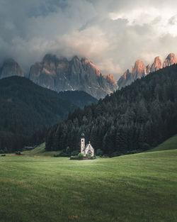 Scenic view of field and mountains against sky