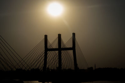 Low angle view of bridge against sky during sunset