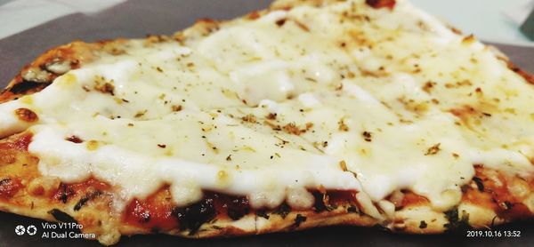 Close-up of pizza served in plate