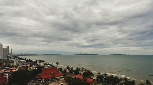 High angle view of buildings and sea against sky