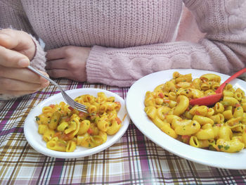 Close-up of hand holding food on table