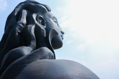 Low angle view of statue against sky