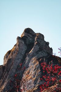 Low angle view of rock formation against sky