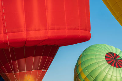 Low angle view of hot air balloon against blue sky