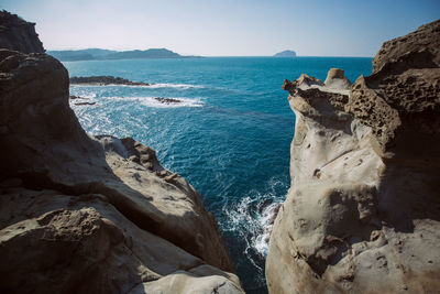 Scenic view of sea against clear blue sky