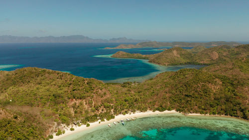 Tropical island bulalacao with blue lagoon, coral reef and sandy beach.  .