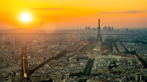 High angle view of city buildings during sunset