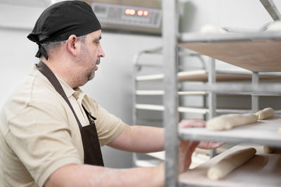 Baker preparing food at bakery