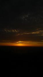 Scenic view of sea against sky at sunset