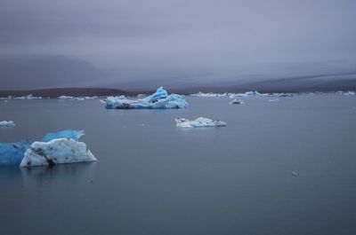 Scenic view of frozen sea against sky