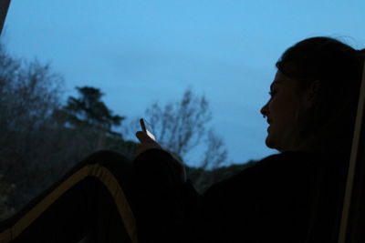 Low angle view of silhouette man against sky
