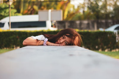 Portrait of woman lying on floor