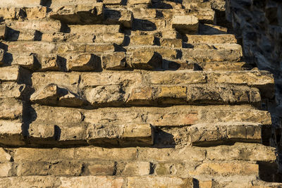 Low angle view of stone wall