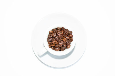 High angle view of coffee beans in white background