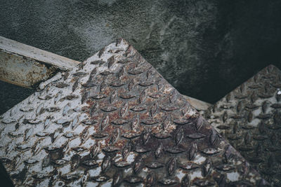 High angle view of old metal wall