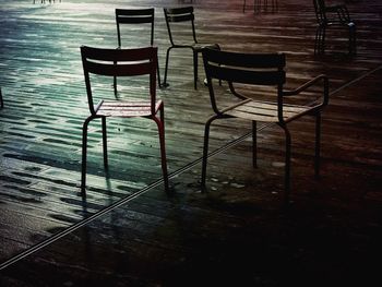 Empty chairs and table on floor