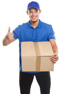 Portrait of a smiling young man against white background