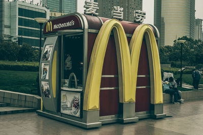 Information sign by buildings in city