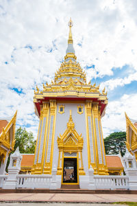 Statue of temple against building