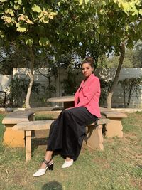 Portrait of woman sitting in park