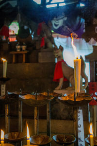 Lit candles in temple