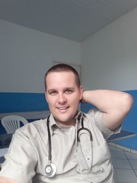 Portrait of smiling young man at home