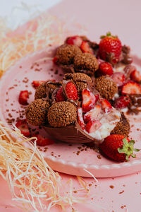 Close-up of strawberries in plate on table